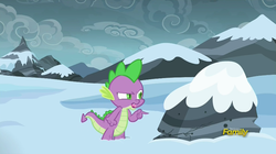 Size: 853x477 | Tagged: safe, screencap, spike, g4, the times they are a changeling, discovery family logo, frown, glare, male, open mouth, pointing, rock, solo