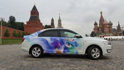 Size: 1024x576 | Tagged: safe, artist:cannibalus, princess celestia, g4, car, decal, irl, itasha, kremlin, moscow, photo, red square, russia, skoda, skoda rapid, st. basil's cathedral