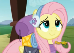 Size: 696x505 | Tagged: safe, screencap, fluttershy, pegasus, pony, dungeons and discords, g4, cropped, cute, discovery family logo, earmuffs, female, happy, lidded eyes, mare, saddle bag, shyabetes, smiling, solo