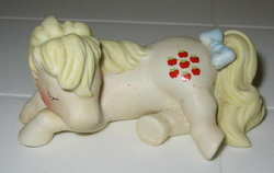 Size: 600x380 | Tagged: safe, photographer:tradertif, applejack (g1), g1, figurine, irl, merchandise, photo, porcelain, sleeping, solo