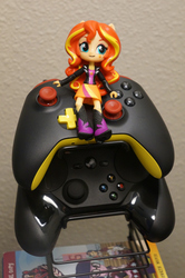 Size: 3264x4912 | Tagged: safe, sunset shimmer, equestria girls, g4, my little pony equestria girls: friendship games, clothes, controller, doll, dvd, equestria girls minis, irl, photo, skirt, steam controller, toy, xbox controller, xbox one controller