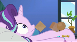 Size: 2511x1371 | Tagged: safe, screencap, starlight glimmer, pony, unicorn, every little thing she does, g4, season 6, bed, blocks, cube, discovery family logo, female, mare, octahedron, on bed, potted plant, solo, sphere, starlight's room, sudden realization, thousand yard stare