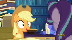 Size: 1273x709 | Tagged: safe, screencap, applejack, starlight glimmer, pony, every little thing she does, g4, season 6, applejack's hat, cowboy hat, discovery family logo, female, fiducia compellia, hat, hypnosis, hypnotized