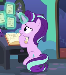 Size: 344x390 | Tagged: safe, screencap, starlight glimmer, pony, every little thing she does, g4, my little pony: friendship is magic, book, female, glowing, glowing horn, hoof under chin, horn, magic, mare, sitting, solo, starlight's room, telekinesis