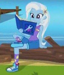 Size: 324x383 | Tagged: safe, screencap, trixie, equestria girls, g4, my little pony equestria girls: legend of everfree, book, clothes, converse, female, lake, log, shoes, sneakers, solo