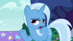 Size: 1280x720 | Tagged: safe, screencap, trixie, pony, unicorn, g4, no second prances, season 6, female, horn, lidded eyes, mare, open mouth, outdoors, raised hoof, solo, tail