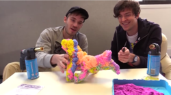 Size: 852x477 | Tagged: safe, artist:kickthepj, artist:pewdiepie, human, pony, 1000 degree knife, barely pony related, blowtorch, craft, foam, irl, irl human, kickthepj, kinetic sand, knife, meme, pewdiepie, photo, playfoam, sand, sculpture, smiling, toy, toy abuse, traditional art, youtube, youtube link
