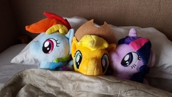 Size: 956x538 | Tagged: safe, applejack, rainbow dash, twilight sparkle, g4, 4de, bed, female, irl, lesbian, looking at you, ot3, photo, picture, pillow, plushie, ship:appledash, ship:twidash, ship:twijack, shipping