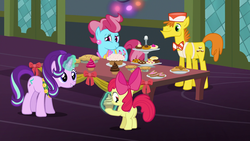 Size: 1920x1080 | Tagged: safe, screencap, apple bloom, carrot cake, cup cake, starlight glimmer, pony, a hearth's warming tail, g4, 1080p, cake, cookie, cupcake, cutie mark, female, filly, food, magic, musical instrument, pie, tambourine, telekinesis, the cmc's cutie marks