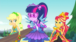 Size: 1100x618 | Tagged: safe, screencap, applejack, sci-twi, sunset shimmer, twilight sparkle, equestria girls, g4, my little pony equestria girls: legend of everfree, carrying, clothes, crystal guardian, crystal wings, freckles, gloves, log, pants, ponied up, scenery, super ponied up, super strength, visor