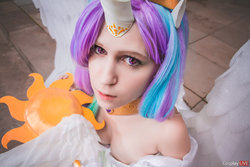 Size: 1280x853 | Tagged: safe, artist:fox-tsai-sheng, princess celestia, human, g4, clothes, contact lens, cosplay, costume, irl, irl human, looking at you, photo, smiling, solo, spread wings, staff