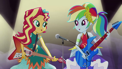 Size: 1280x720 | Tagged: safe, screencap, rainbow dash, sunset shimmer, equestria girls, g4, my little pony equestria girls: legend of everfree, clothes, crystal gala, dress, electric guitar, female, flying v, guitar, guitar pick, legend you were meant to be, microphone, musical instrument, spotlight, stage, sunset shredder