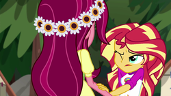 Size: 1280x720 | Tagged: safe, screencap, gloriosa daisy, sunset shimmer, equestria girls, g4, my little pony equestria girls: legend of everfree, flower, flower in hair, one eye closed