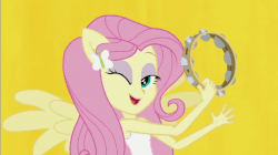 Size: 600x337 | Tagged: safe, screencap, fluttershy, equestria girls, g4, my little pony equestria girls: rainbow rocks, animated, better than ever, female, gif, musical instrument, one eye closed, ponied up, solo, tambourine