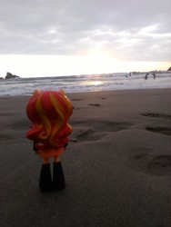 Size: 1944x2592 | Tagged: safe, sunset shimmer, human, equestria girls, g4, beach, clothes, doll, equestria girls minis, eqventures of the minis, irl, irl human, ocean, photo, pun, sand, skirt, sunset, toy, visual pun