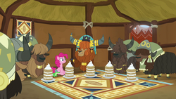 Size: 1280x720 | Tagged: safe, screencap, gummy, pinkie pie, prince rutherford, yvette, alligator, earth pony, pony, yak, g4, not asking for trouble, cake, cloven hooves, female, food, male, mare, sitting, smiling, unnamed character, unnamed yak, yakyakistan