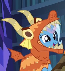Size: 602x655 | Tagged: safe, screencap, trixie, pony, unicorn, g4, uncommon bond, clothes, costume, cute, diatrixes, dragon costume, female, glowing horn, horn, mare, open mouth, smiling, solo