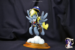 Size: 4608x3072 | Tagged: safe, artist:shuxer59, derpy hooves, pegasus, pony, g4, clothes, female, figurine, flying, fourth doctor's scarf, mail, mailmare, mare, photo, saddle bag, scarf, sculpture, solo, striped scarf, traditional art, underp