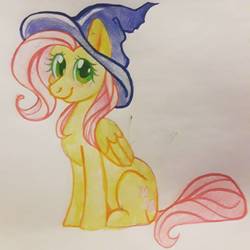 Size: 1210x1210 | Tagged: safe, artist:babuuroy, fluttershy, pegasus, pony, g4, female, folded wings, hat, looking at you, mare, sitting, smiling, solo, traditional art, watercolor painting, wings, witch hat