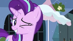 Size: 1280x720 | Tagged: safe, screencap, starlight glimmer, pony, unicorn, g4, the crystalling, building, crystal empire, female, grin, mare, one eye closed, smiling, snow, solo, wink, winter