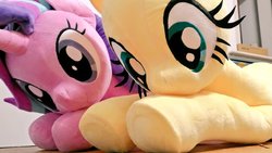 Size: 1024x576 | Tagged: safe, artist:nekokevin, fluttershy, starlight glimmer, pegasus, pony, unicorn, g4, cute, duo, female, glimmerbetes, irl, life size, looking down, lying down, mare, photo, plushie, shyabetes, smiling