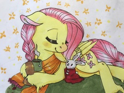 Size: 4032x3024 | Tagged: safe, artist:scarletkk, angel bunny, fluttershy, g4, blanket, braid, braided tail, clothes, cozy, cup, cute, duo, eyes closed, floppy ears, folded wings, food, hoof hold, kindness, prone, scarf, shyabetes, smiling, tea, traditional art, turned head, unshorn fetlocks, wings