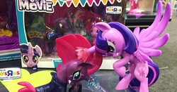 Size: 1080x567 | Tagged: safe, tempest shadow, twilight sparkle, alicorn, pony, g4, my little pony: the movie, abuse, angry, angry eyes, eye scar, fight, irl, magic, misadventures of the guardians, photo, scar, statue, tempestbuse, toy, toys r us, twilight sparkle (alicorn)