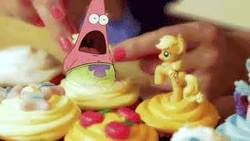 Size: 300x169 | Tagged: safe, applejack, human, g4, crappy art, cupcake, food, hand, implied vore, irl, male, patrick star, photo, solo, spongebob squarepants, toy
