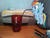 Size: 2592x1944 | Tagged: safe, artist:a4r91n, rainbow dash, pegasus, pony, g4, bendy straw, book, desk, drinking, drinking straw, floating, irl, micro, photo, ponies in real life, printer, solo, straw