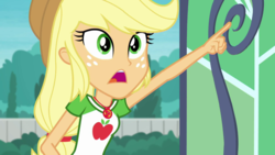 Size: 1280x720 | Tagged: safe, screencap, applejack, equestria girls, equestria girls series, g4, my little shop of horrors, applejack's hat, clothes, collar, cowboy hat, female, freckles, geode of super strength, hat, jewelry, looking up, low ponytail, magical geodes, necklace, open mouth, pointing, ponytail, shirt, solo, stetson, t-shirt, teenager, wide eyes