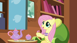 Size: 1280x720 | Tagged: safe, screencap, fluttershy, pegasus, pony, discordant harmony, g4, cup, cute, female, mare, open mouth, sandwich crust, shyabetes, sitting, smiling, solo, teacup, teapot, underhoof