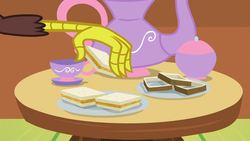 Size: 1280x720 | Tagged: safe, screencap, discord, discordant harmony, g4, carrot-ginger sandwich, cup, food, male, sandwich, sandwich crust, solo, table, teacup, teapot
