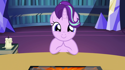 Size: 1920x1080 | Tagged: safe, screencap, starlight glimmer, pony, unicorn, g4, uncommon bond, 1080p, board game, book, bookshelf, c:, candle, cute, dragon pit, female, glimmerbetes, hair flip, hair over one eye, horn, looking at you, mare, smiling, table, twilight's castle, weapons-grade cute