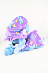 Size: 3648x5472 | Tagged: safe, artist:kazzysart, trixie, pony, g4, absurd resolution, beanie (plushie), cape, clothes, hat, irl, photo, plushie, prone, solo, trixie's cape, trixie's hat