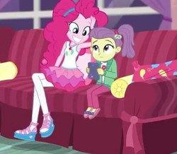 Size: 407x355 | Tagged: safe, screencap, lily pad (g4), pinkie pie, equestria girls, g4, my little pony equestria girls: better together, pinkie sitting, clothes, couch, cropped, duo, female, hairband, jacket, magical geodes, out of context, pants, pantyhose, shoes, side ponytail, skirt, smiling, young