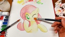 Size: 5312x2988 | Tagged: safe, artist:kemofoo, fluttershy, human, pegasus, pony, g4, :<, acrylic painting, blushing, bust, cute, female, fourth wall, hand, irl, irl human, mare, one eye closed, photo, portrait, shyabetes, solo, traditional art, watercolor painting