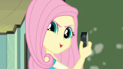 Size: 739x413 | Tagged: safe, screencap, fluttershy, a little birdie told me, equestria girls, g4, my little pony equestria girls: better together, animated, dramatic widescreen, evil grin, female, flutterbadass, grin, make my day, pure unfiltered evil, smiling, smirk, solo