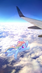 Size: 1029x1800 | Tagged: safe, artist:kkmrarar, rainbow dash, pegasus, pony, g4, cloud, female, flying, irl, mare, photo, plane, ponies in real life, sky, solo