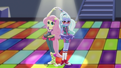 Size: 1912x1072 | Tagged: safe, screencap, fluttershy, sugarcoat, equestria girls, equestria girls specials, g4, my little pony equestria girls: dance magic, ballet slippers, clothes, converse, duo, female, glasses, pigtails, ponied up, pose, shoes, skirt, sneakers, socks, sugarcoat tutu, twintails