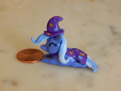 Size: 4608x3456 | Tagged: safe, artist:tinyblissfulness, trixie, pony, unicorn, g4, eyes closed, female, irl, mare, penny, photo, prone, sculpture, solo, traditional art
