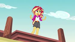 Size: 1280x720 | Tagged: safe, screencap, sunset shimmer, equestria girls, g4, my little pony equestria girls: legend of everfree, camp everfree outfits, clothes, embrace the magic, female, open mouth, pier, shorts, singing, solo