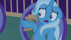 Size: 1280x720 | Tagged: safe, screencap, trixie, pony, g4, to where and back again, female, floppy ears, mare, open mouth, pointing, scared, shrunken pupils, solo, trixie's wagon, underhoof, wheel