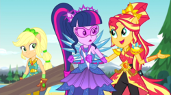 Size: 1100x618 | Tagged: safe, screencap, applejack, sci-twi, sunset shimmer, twilight sparkle, equestria girls, g4, my little pony equestria girls: legend of everfree, clothes, crystal guardian, crystal wings, gloves, open mouth, pants, ponied up, scenery, super strength
