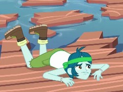 Size: 330x247 | Tagged: safe, screencap, captain planet, equestria girls, g4, my little pony equestria girls: legend of everfree, background human, boots, clothes, lake, male, pier, shoes, shorts, solo