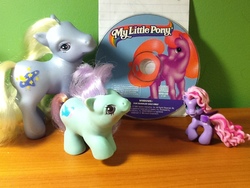 Size: 960x720 | Tagged: safe, artist:iluvchedda, moondancer (g3), peeks, starsong, pony, g1, g2, g3, g3.5, my little pony: friendship gardens, baby, baby pony, cd, collection, irl, photo, square crossover, toy