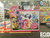 Size: 1600x1200 | Tagged: safe, applejack, fluttershy, pinkie pie, princess celestia, princess luna, rainbow dash, rarity, twilight sparkle, alicorn, earth pony, pegasus, pony, unicorn, g4, aquaman, batman, board game, captain cold, cheetah (dc comics), comic book, dc comics, doctor fate, green arrow, green lantern, hatless, hawkman, irl, justice league, legion of doom (dc comics), lex luthor, looking at you, lunchbox, male, mane six, merchandise, missing accessory, my little pony logo, photo, s1 luna, smiling, stock vector, superman, the flash, the joker, the scarecrow, the scarecrow (dc), toy fair, toy fair 2017, twilight sparkle (alicorn), wall of tags, watermark, wonder woman