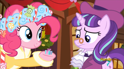 Size: 853x478 | Tagged: safe, screencap, pinkie pie, snowfall frost, spirit of hearth's warming presents, starlight glimmer, pony, a hearth's warming tail, g4, discovery family logo, pinkie's present, present, tiny, visual gag