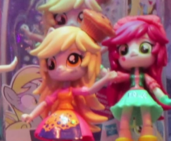 Size: 571x471 | Tagged: safe, derpy hooves, roseluck, equestria girls, g4, clothes, doll, equestria girls minis, irl, photo, skirt, toy, toy fair, toy fair 2017