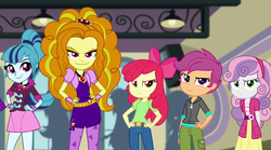 Size: 1280x714 | Tagged: safe, screencap, adagio dazzle, apple bloom, scootaloo, sonata dusk, sweetie belle, equestria girls, g4, my little pony equestria girls: rainbow rocks, angry, apple bloom is not amused, evil smile, grin, hand on hip, looking at you, scootaloo is not amused, smiling, sweetie belle is not amused, the cutie mark crusaders are not amused, unamused