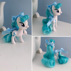 Size: 600x600 | Tagged: safe, artist:egophiliac, rarity, pony, unicorn, g4, alternate hairstyle, bow, brushable, customized toy, female, irl, mare, open mouth, photo, raised hoof, rehaired, solo, standing, toy